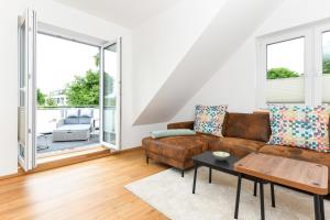 a living room with a couch and a table at Alte Molkerei in Esens