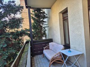 a chair and a table on a balcony at Wohnung mit Balkon in Zwickau