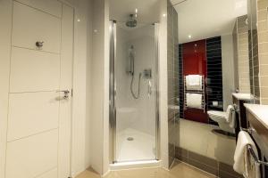 a bathroom with a shower and a sink at Dakota Edinburgh in Queensferry +45 photos