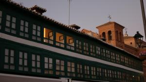 a building with a clock tower on top of it at Almagro Plaza Apartamento in Almagro +40 photos