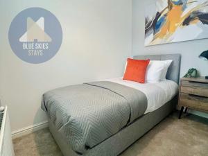 a bedroom with a bed and a sign that says blue skies stars at Puffin House in Seaton Carew +9 photos