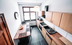 a small kitchen with a table and a counter at Ferienwohnung Elb-Aue in Burg bei Magdeburg