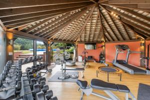 a gym with chairs and exercise equipment in a building at Broadridge Manor in West Worlington
