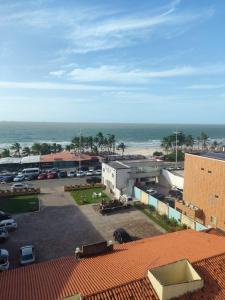 a view of a parking lot and the ocean at Mar à vista in São Luís