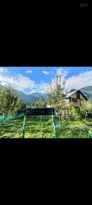 a train is on the tracks in a field at Peace homestay n cafe in Kalgha
