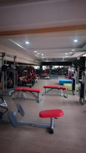 a gym with red and blue tables and benches at MSC Sport Campus in Marrakesh
