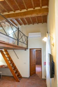 a room with a bunk bed and a staircase at La casina di Zora in Lorenzana