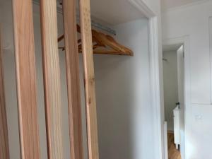 a closet with wooden beams in a room at Azores Pedra Apartaments A in Fajã de Baixo