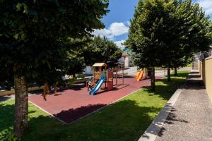 a playground with a slide in a park at Casa Fermil da Graça in Veade