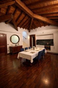 a large dining room with a table and chairs at Atelier Monte Bago in Felegara