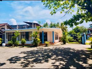 a house with a driveway in front of it at GMW Sanduni hotel & villa in Matara