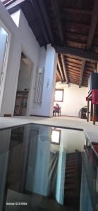 a house with a pool in front of a house at Skyline Virgilio SUITE sottotetto vista MARE parking in San Marino