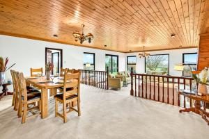 a dining room with a table and chairs at Mullaghmore Holiday Home in Cliffony