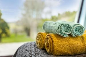 a stack of towels sitting on top of a table at Mullaghmore Holiday Home in Cliffony +54 photos