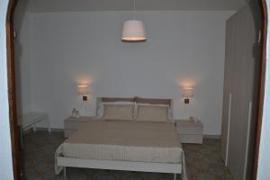 A bed or beds in a room at Charming Place Taormina