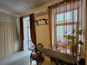 a living room with a table and a window at Хостел Палац Спорта in Kyiv