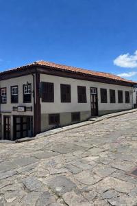 a large white building with a lot of windows at Sollarium Pousada in Diamantina
