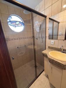 a bathroom with a shower and a sink at Sollarium Pousada in Diamantina +31 photos