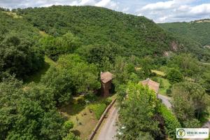 an aerial view of a mountain with a building at Le Gîte de Saint Izaire in Saint-Izaire