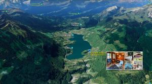 arial view of a lake in a mountain at Chalet Oasis - Your Alpine Hideaway in Bürglen