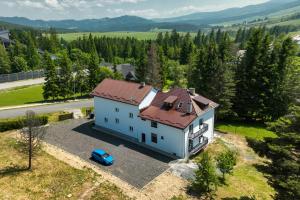 an aerial view of a house with a red roof at Apartmán Altis in Tatranska Strba
