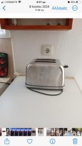 a toaster sitting on top of a kitchen counter at Aidonofolies in Koukounaries +23 photos
