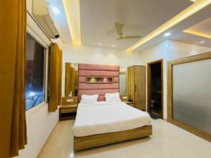 a bedroom with a large bed in a room at Hotel Silver Bricks in Amritsar +18 photos
