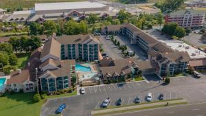 an aerial view of a large building with a parking lot at Accommodations By Willow Brook Lodge in Pigeon Forge
