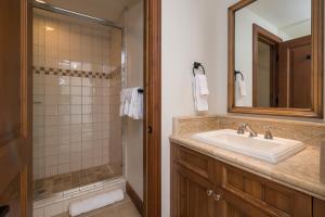 a bathroom with a sink and a shower at Colonnade Residence 11 in Ketchum +11 photos
