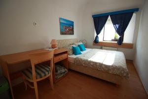 Postel nebo postele na pokoji v ubytování Guesthouse Veles