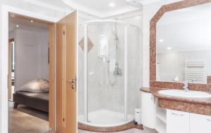 a bathroom with a shower and a sink at ötztalLOFT in Längenfeld +58 photos