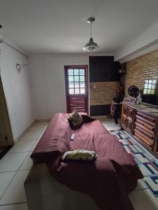 a bedroom with a large bed in a kitchen at Quarto para carnaval Olinda e Recife in Paulista