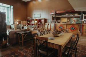 a dining room with a table and chairs in a room at Wildwood Lodge in Pewaukee