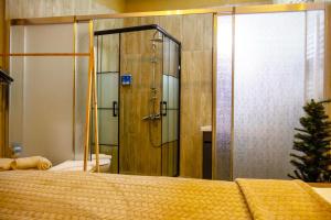 a bedroom with a shower and a bed and a toilet at Seten House in Ürgüp +28 photos