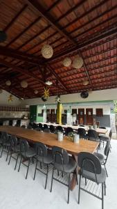 a large long table with chairs in a room at Apartamento Zion reserve suites in Conde