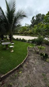 a park with a bench and a picnic table at Apartamento Zion reserve suites in Conde +12 photos
