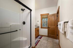 a bathroom with a shower and a sink at Moose Meadow in Welches +30 photos