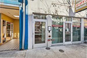 an entrance to a store with revolving doors on a street at Ther Gregory Suite 101 ADA in New Orleans
