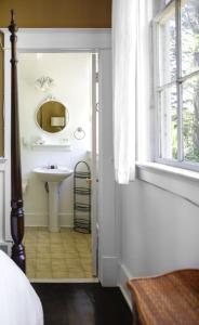 a bathroom with a sink and a mirror at Inn at Harbour Village in Ilwaco +38 photos