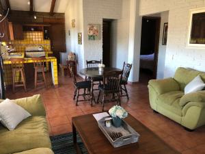 a living room with a couch and a table at Happy Trails in San Antonio