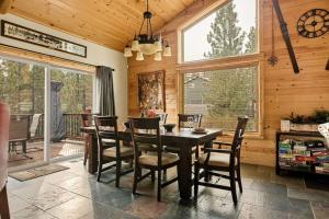 a dining room with a table and chairs at Bear Creek Lodge with Hot Tub in Big Bear Lake