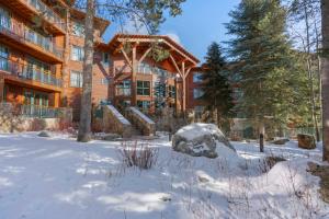 a house with snow in front of it at Teton Club in Teton Village