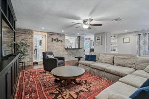 a living room with a couch and a table at Villa Manteago in Bradenton