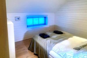 a room with a bed with two bags on it at Studio Svartbygget in Åre