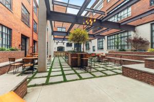a courtyard with tables and chairs in a building at 2125 Superior Living in Cleveland
