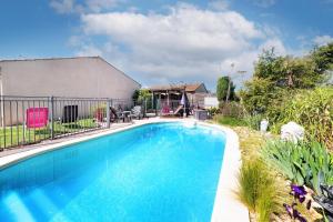 a swimming pool in front of a house at Gite la Provençale in Albi