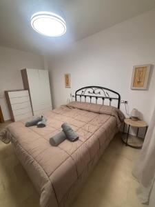 a bedroom with a large bed with two pillows on it at ElFogaril in Teruel