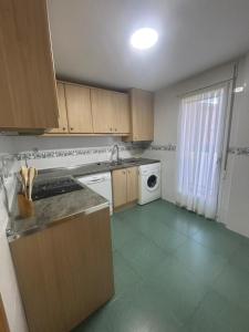 a kitchen with a sink and a dishwasher at ElFogaril in Teruel +8 photos
