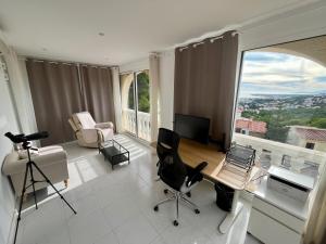 a living room with a view of a city at Chalet con piscina y vistas en Urb Marcolina, Alcocéber in Alcossebre