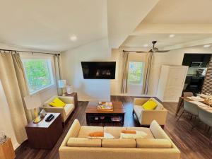 a living room with a couch and a table at HPThe Abode Downtown Bojangles Dogs Welcome Yard in Charlotte
